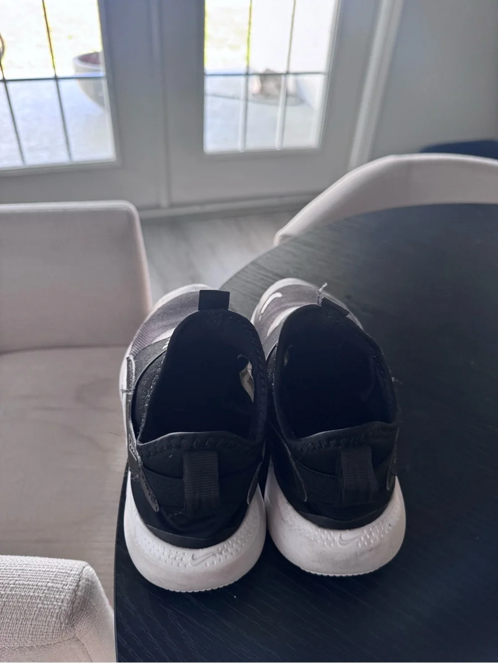 Nike Black Slip-On Sneakers with White Logo Accents